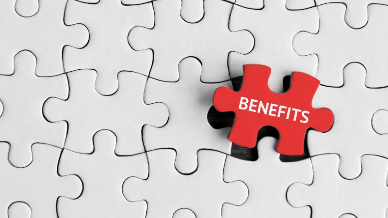 benefits of hybrid generators A red puzzle piece with the word 'BENEFITS' written on it, fitting into a larger puzzle of white pieces.