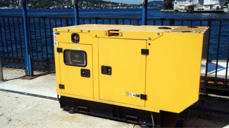 Generator equipment on a waterfront dock, yellow portable power generator outdoors, industrial power source, deep blue water background, commercial generator for marine or construction use, durable and weather-resistant design.